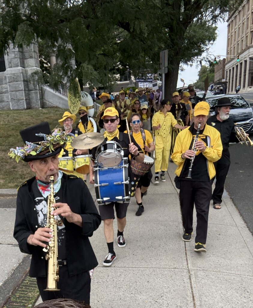 The Expandables performing during a Labor Day march on September 1 2025.
